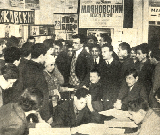 В. Маяковский среди молодежи на выставке '20 лет работы Маяковского'. 1930